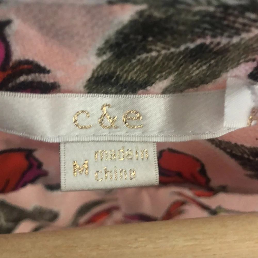 Pink floral lightweight sleeveless top. Triangle cutout at neckline. Medium - Picture 4 of 5